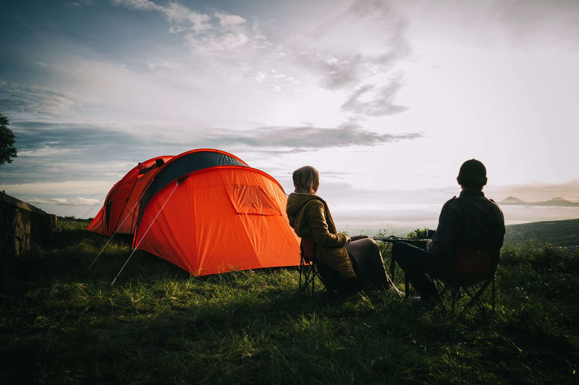 asian-couple-camping-with-sunrise-view-in-mountain.jpg